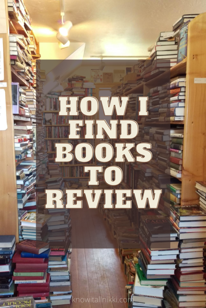 aisle way of books stacked in corners and on book shelves