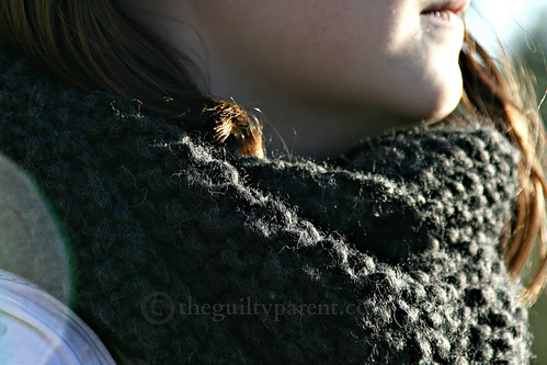 image of neck warmer around girl's neck, cowl, black yarn seed stitch pattern Gap-tastic Cowl